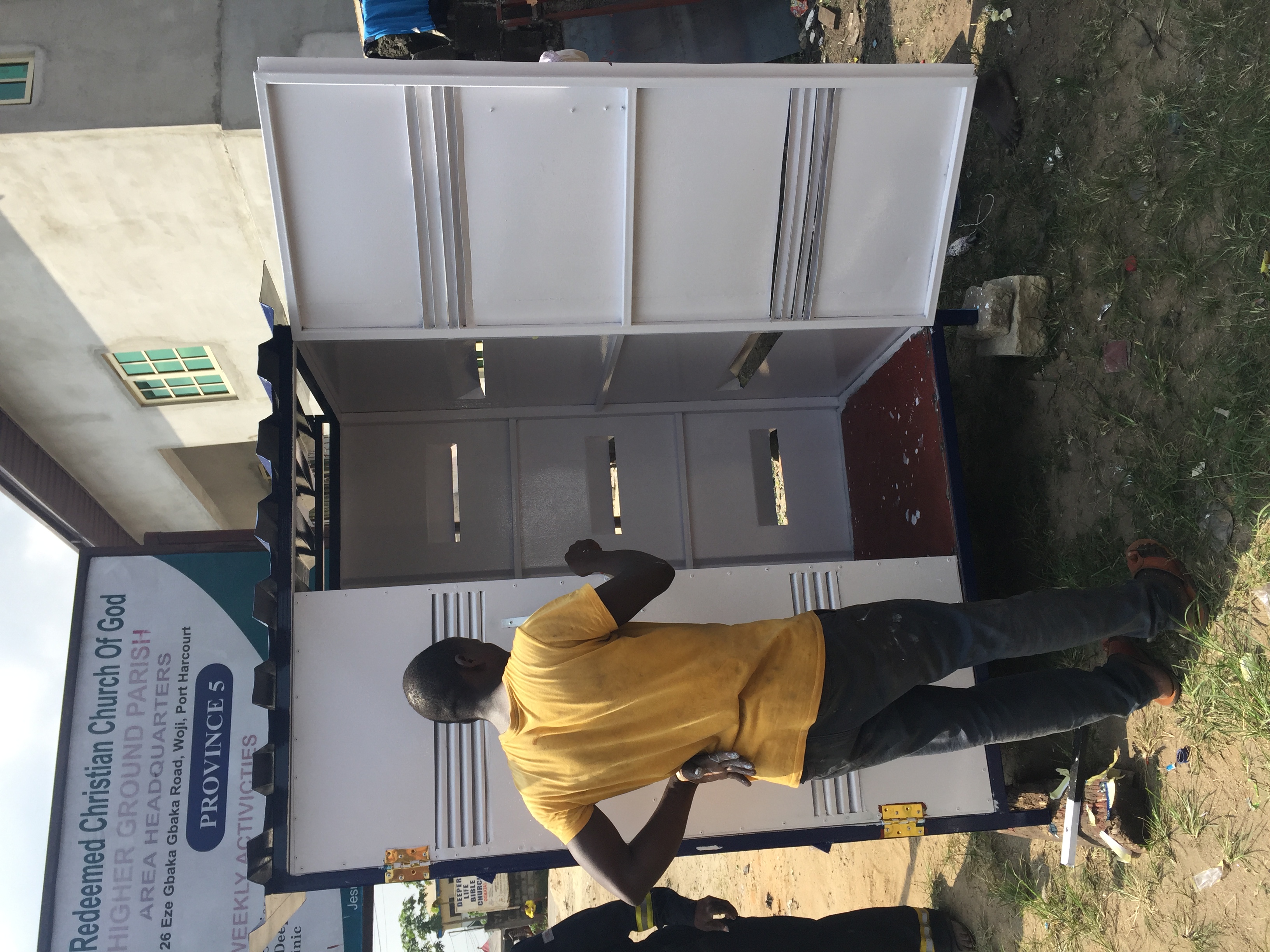 inverter-storage-unit-doors-being-painted-white